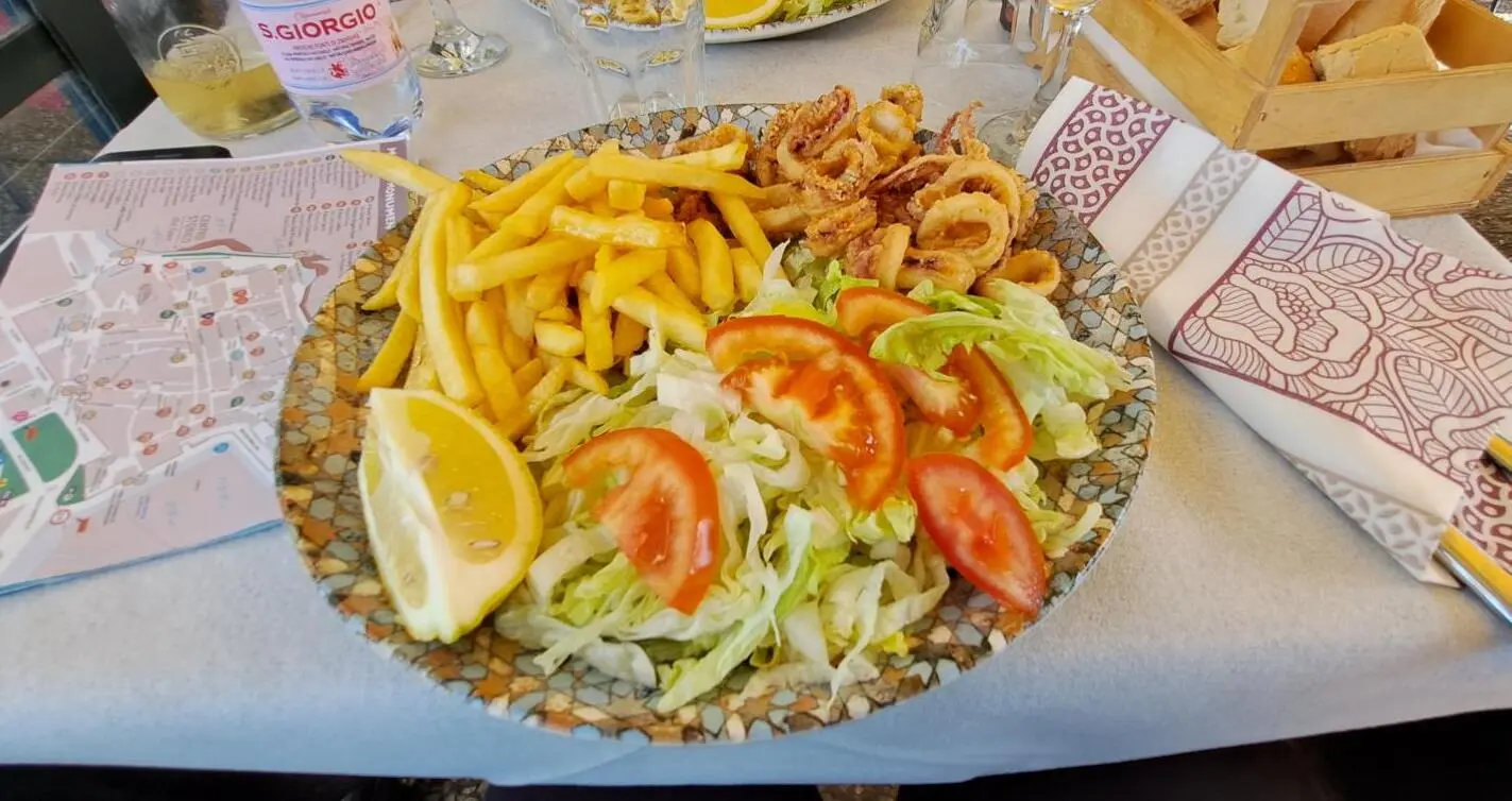 Calamari, potatoes and salad at restaurant il Porto
