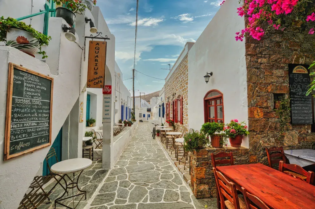Charming white houses with blue doors in Chora, Folegandros