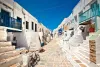 Charming white houses with blue doors in Chora, Folegandros